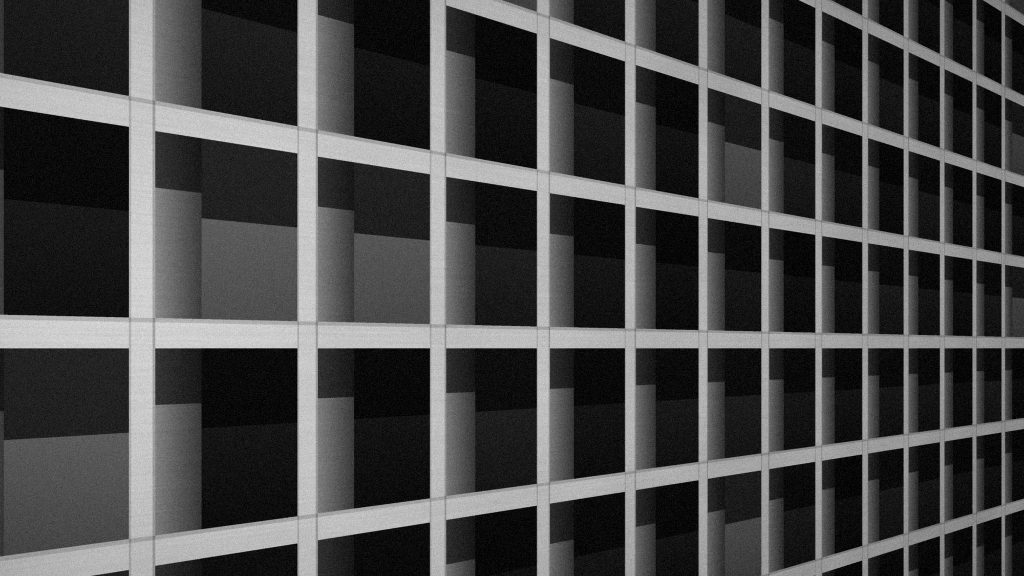 A deep concrete window grid seen at an angle, in black and white.
